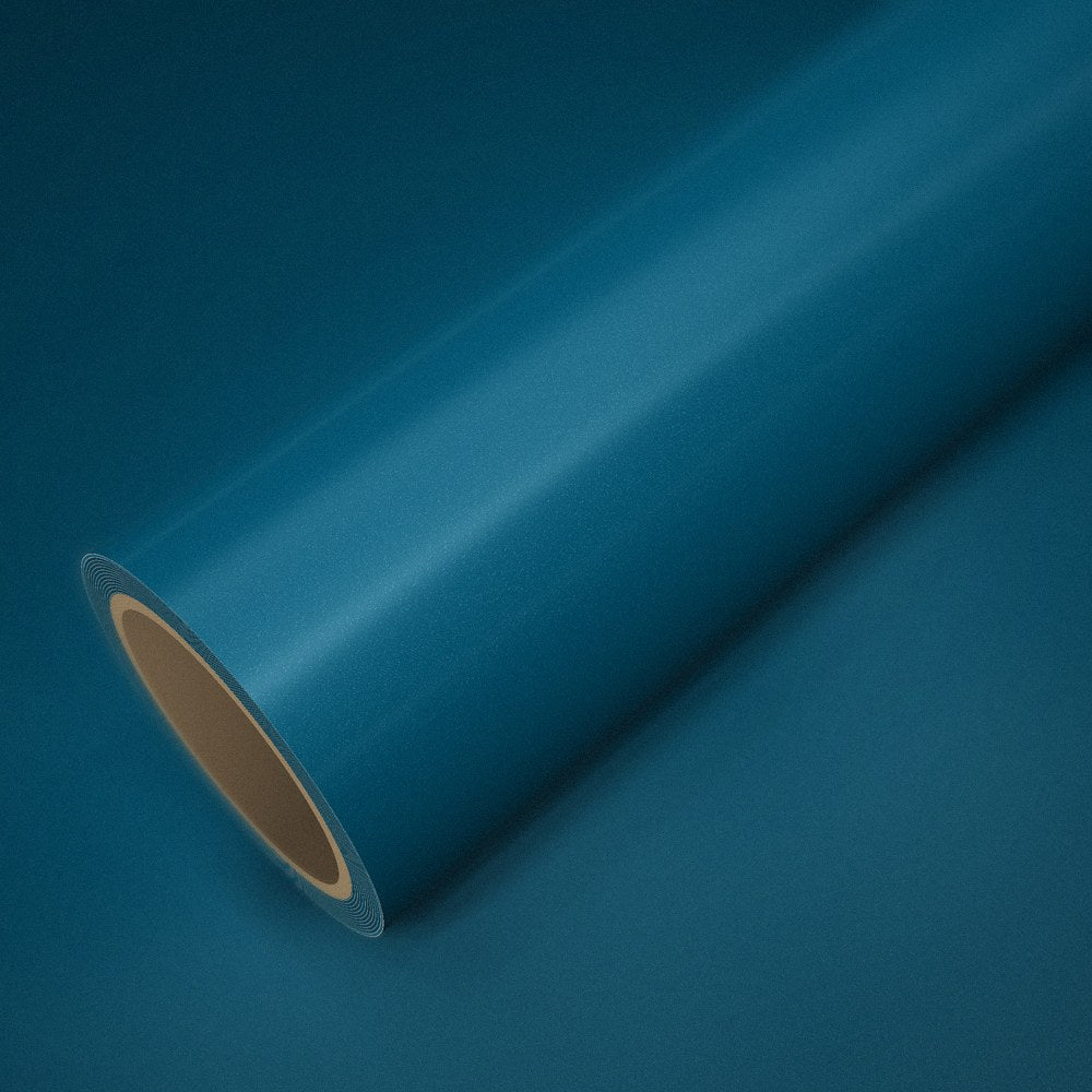 Roll of ICR® peacock green vinyl wrap on a sheet of the same vinyl