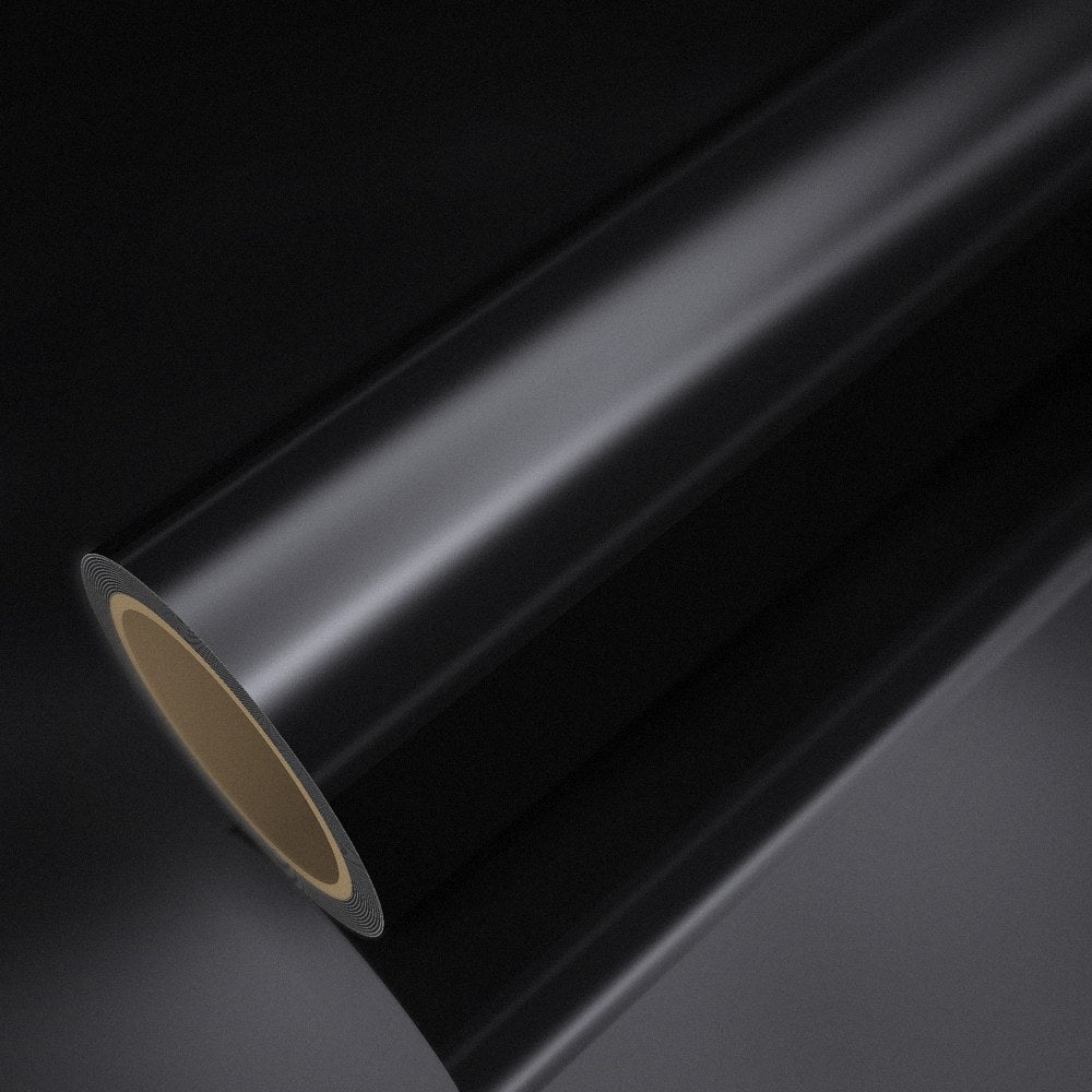 Roll of black chrome vinyl wrap on a sheet of the same vinyl