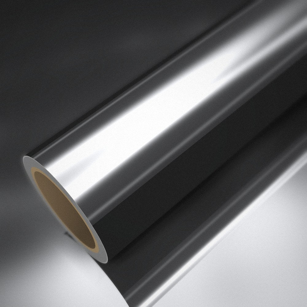 Roll of silver chrome vinyl wrap on a sheet of the same vinyl