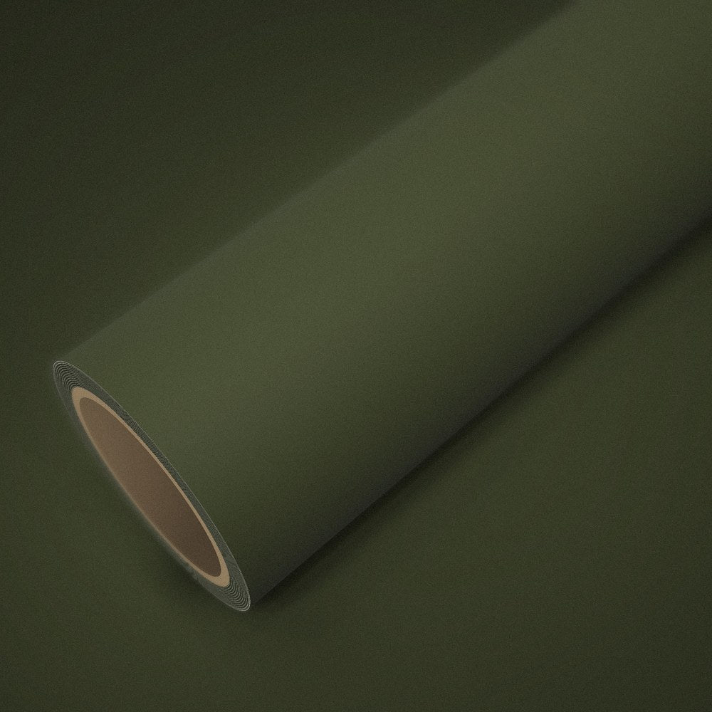 Roll of matte military green vinyl wrap on a sheet of the same vinyl