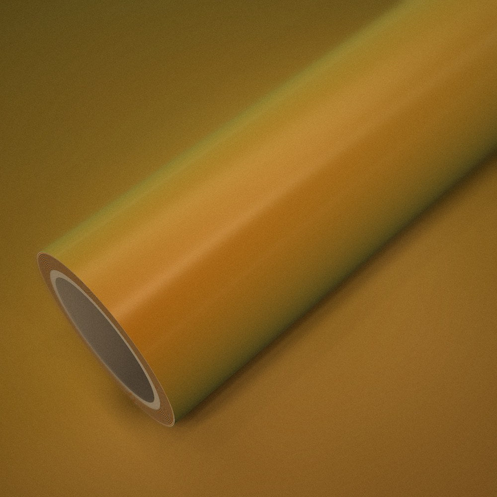 Roll of magic orange-gold vinyl wrap on a sheet of the same vinyl
