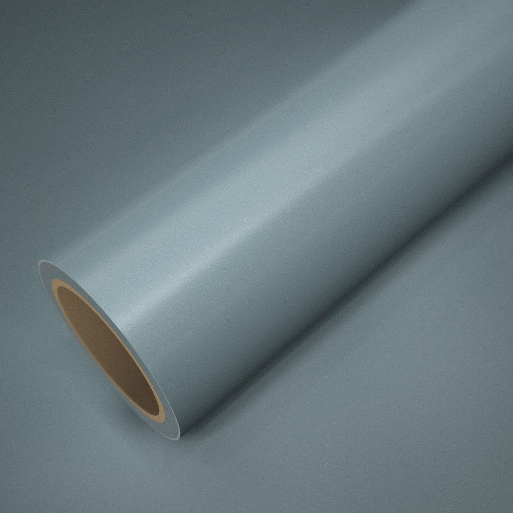 Roll of ICR® night grey vinyl wrap on a sheet of the same vinyl