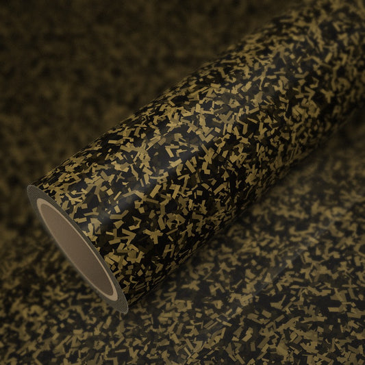 Roll of gloss gold forged carbon vinyl wrap on a sheet of the same vinyl