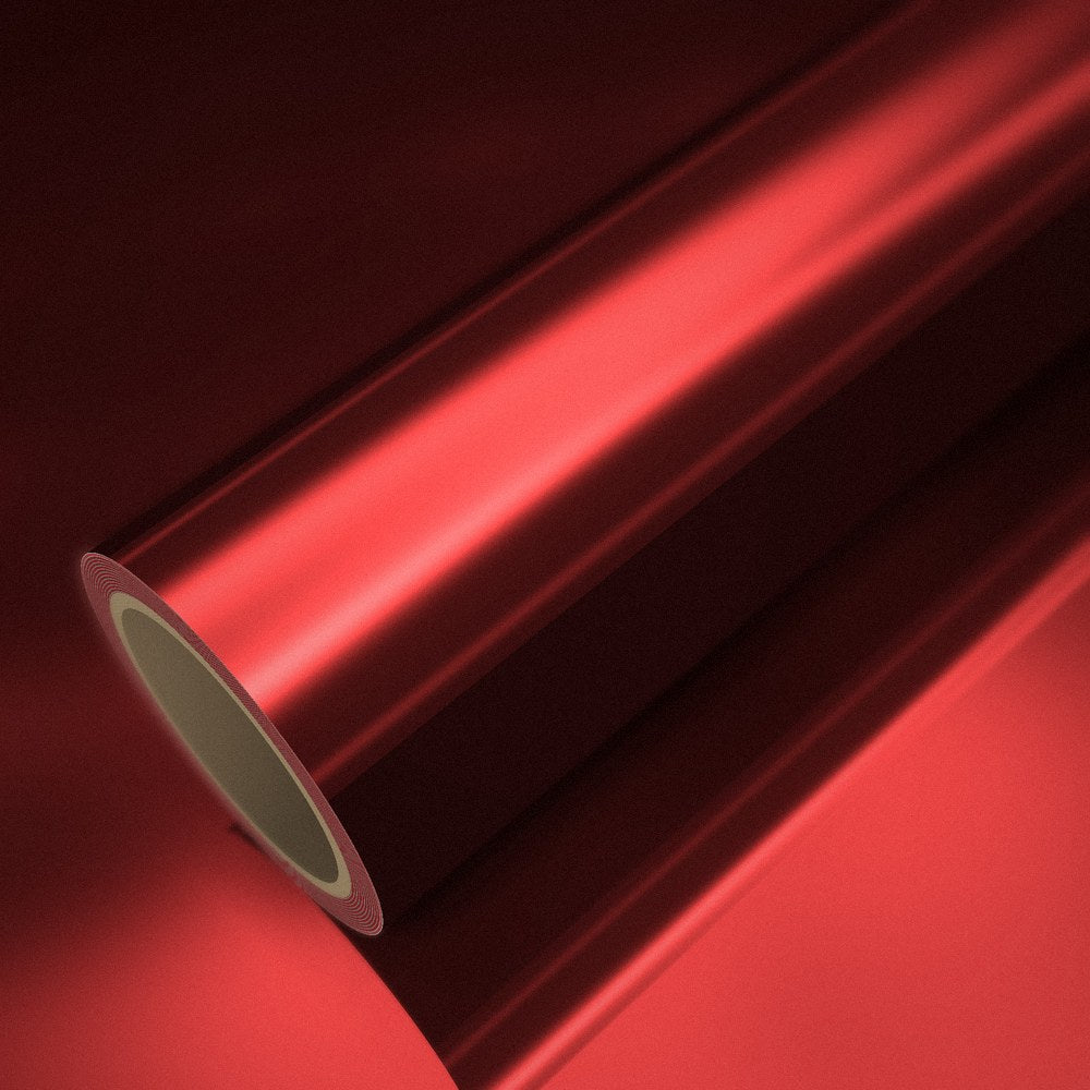 Roll of red chrome vinyl wrap on a sheet of the same vinyl