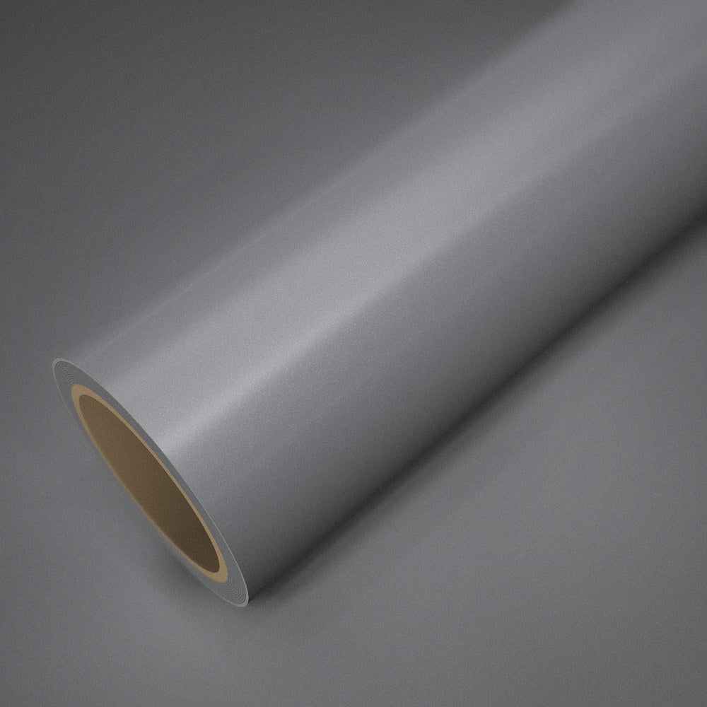 Roll of gloss silver vinyl wrap on a sheet of the same vinyl