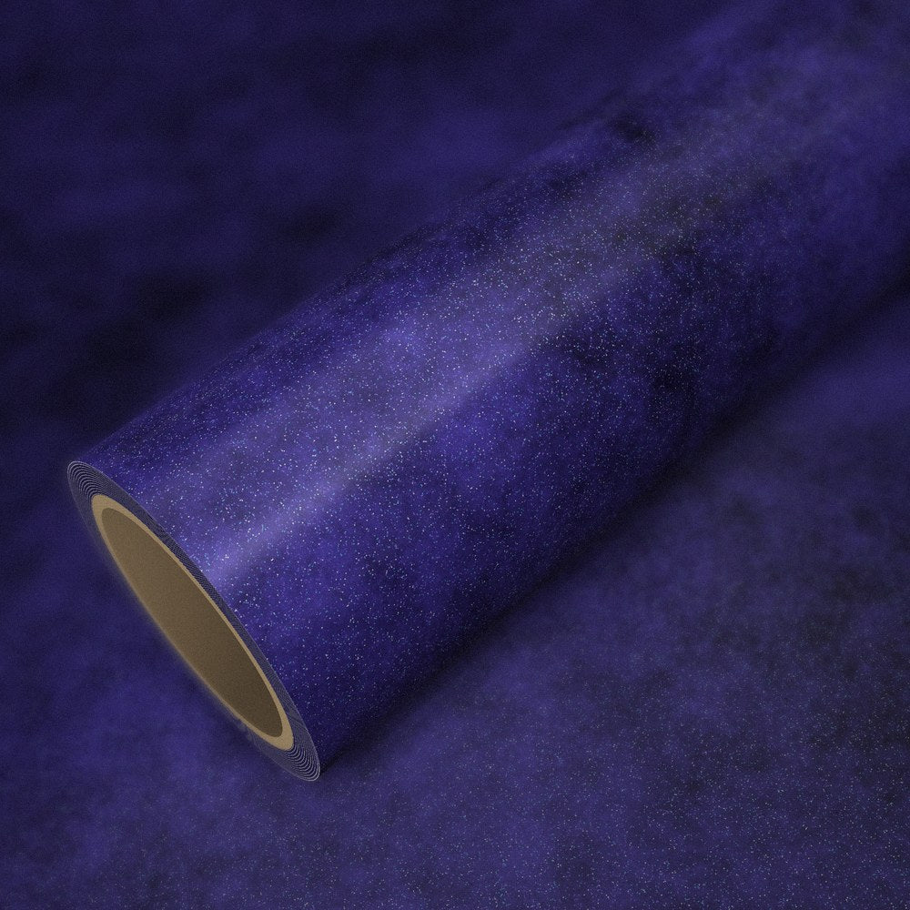 Roll of blue-purple diamond vinyl wrap on a sheet of the same vinyl