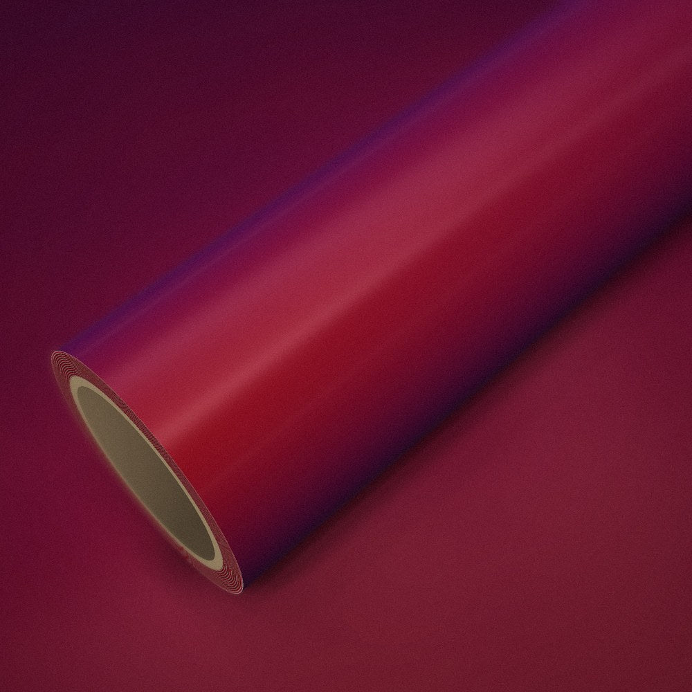 Roll of magic red (colour flip) vinyl wrap on a sheet of the same vinyl