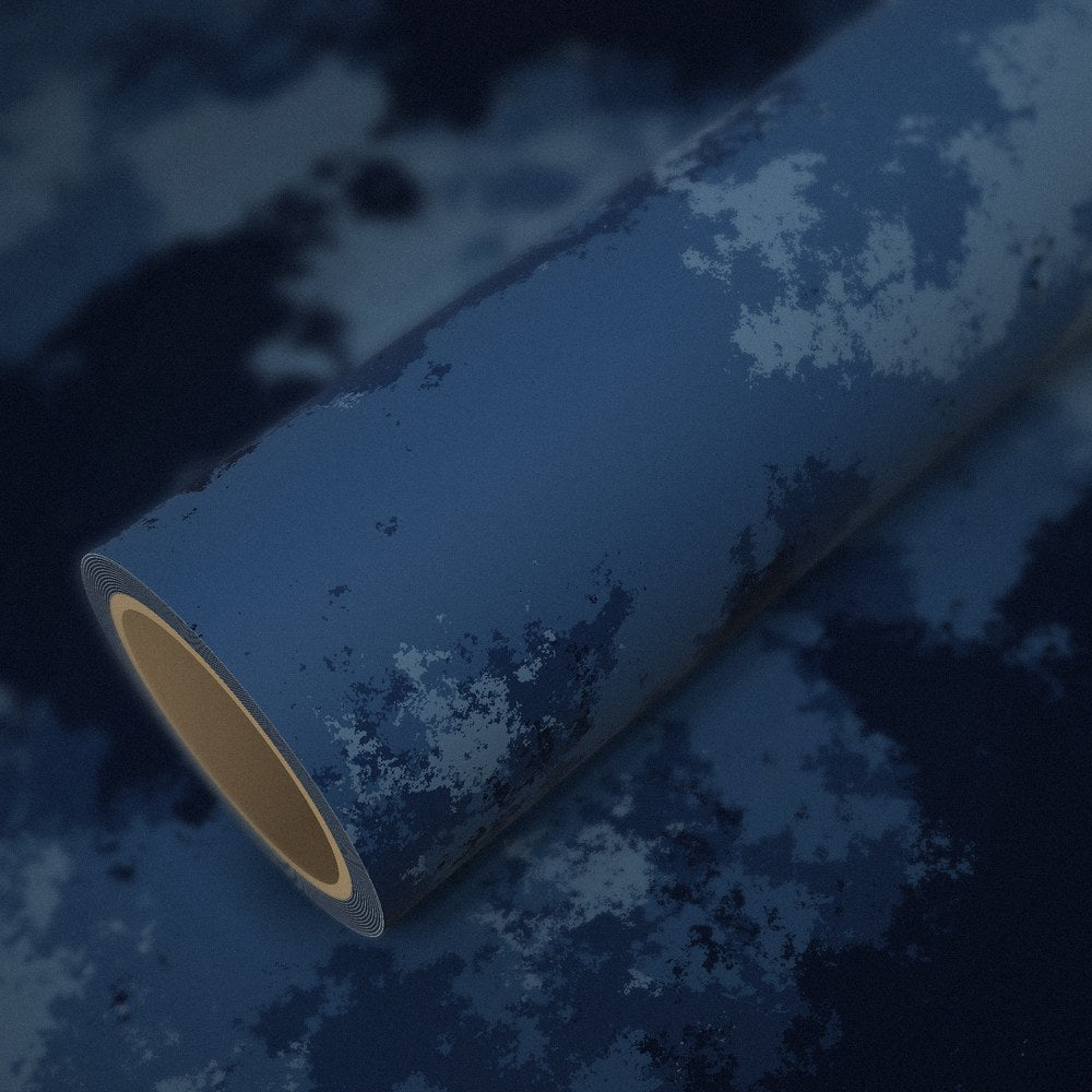 Roll of ocean camo vinyl wrap on a sheet of the same vinyl