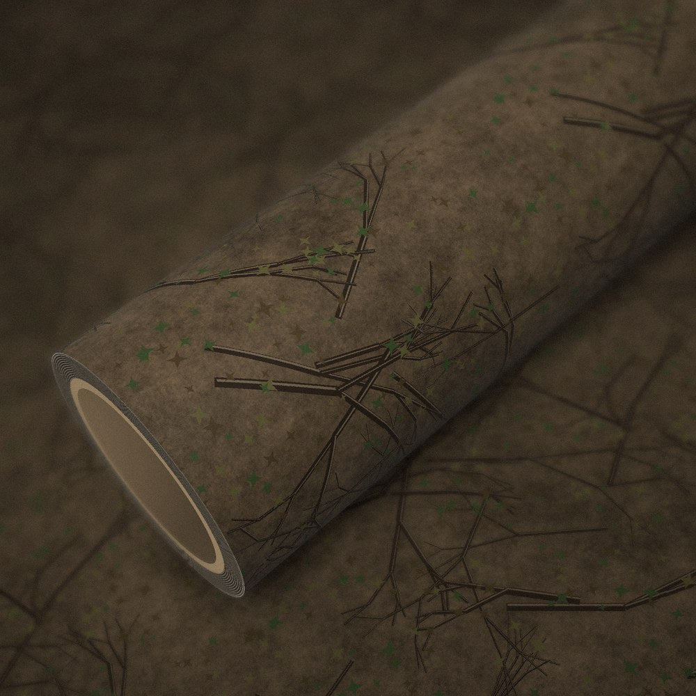 Roll of forest branches camo vinyl wrap on a sheet of the same vinyl