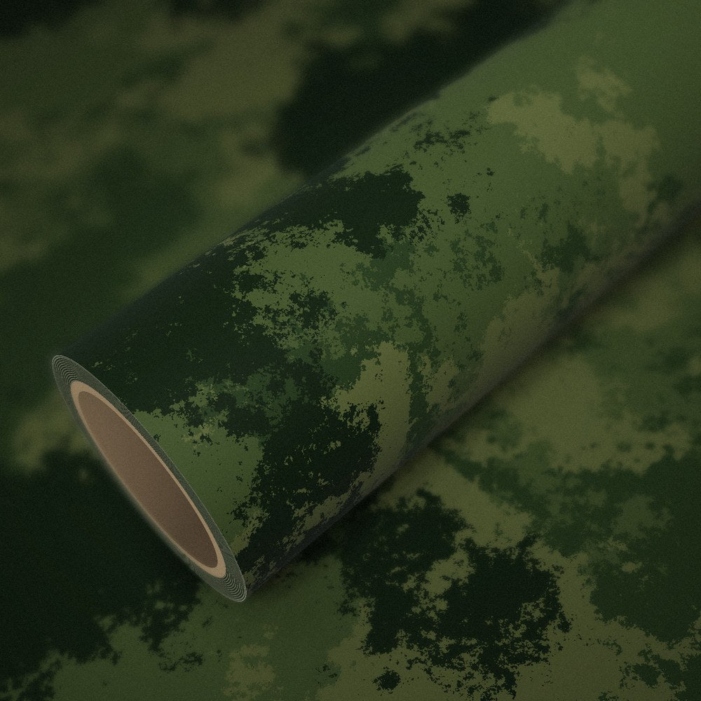 Roll of jungle camo vinyl wrap on a sheet of the same vinyl