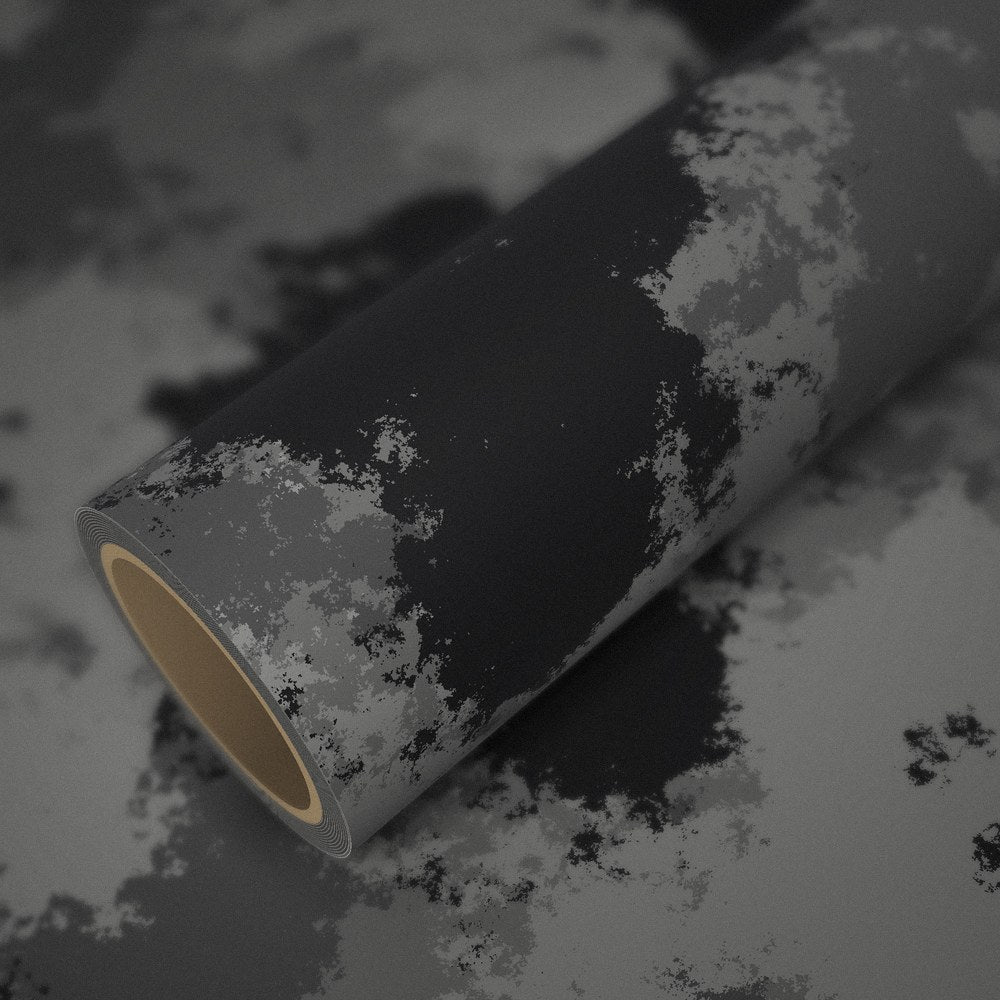 Roll of urban camo vinyl wrap on a sheet of the same vinyl