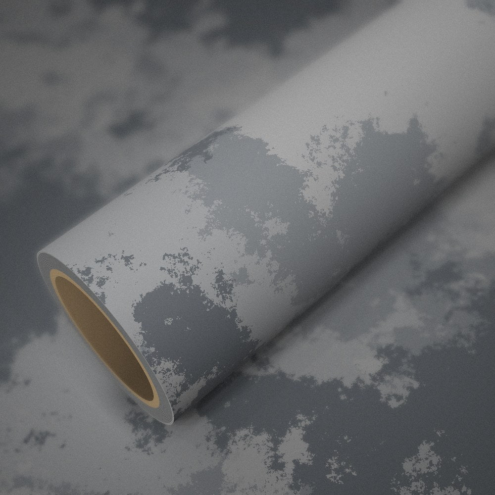 Roll of arctic camo vinyl wrap on a sheet of the same vinyl