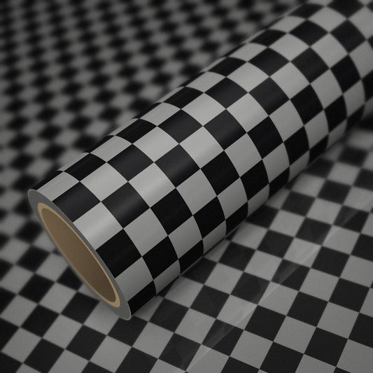 Roll of gloss chequered (Mini style) vinyl wrap on a sheet of the same vinyl