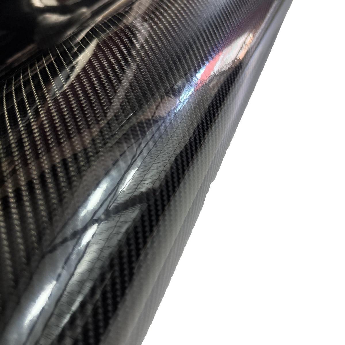 Close-up of the weave of Premium gloss black carbon vinyl